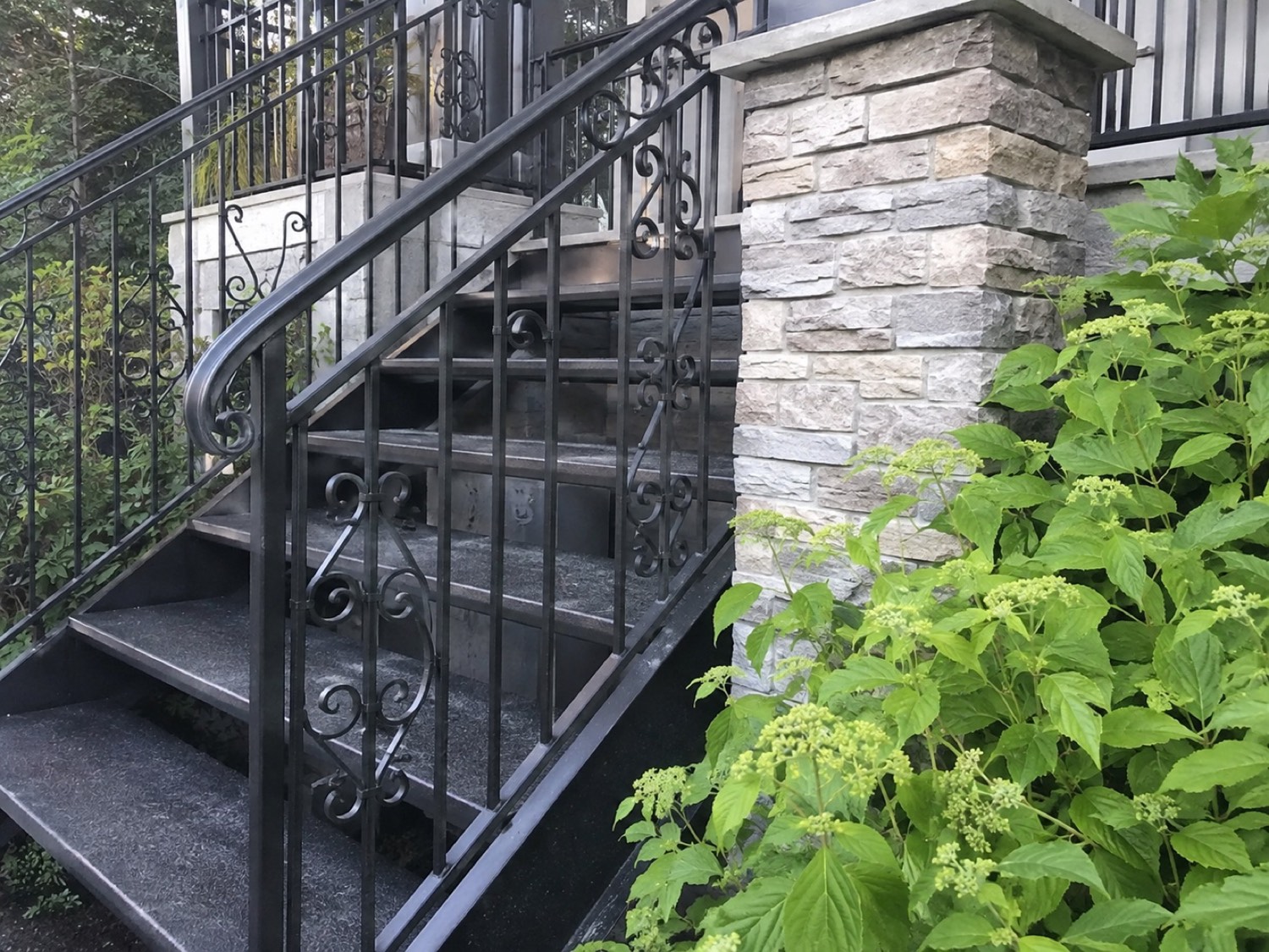 Black wrought iron exterior stair railing on a period East Bay home
